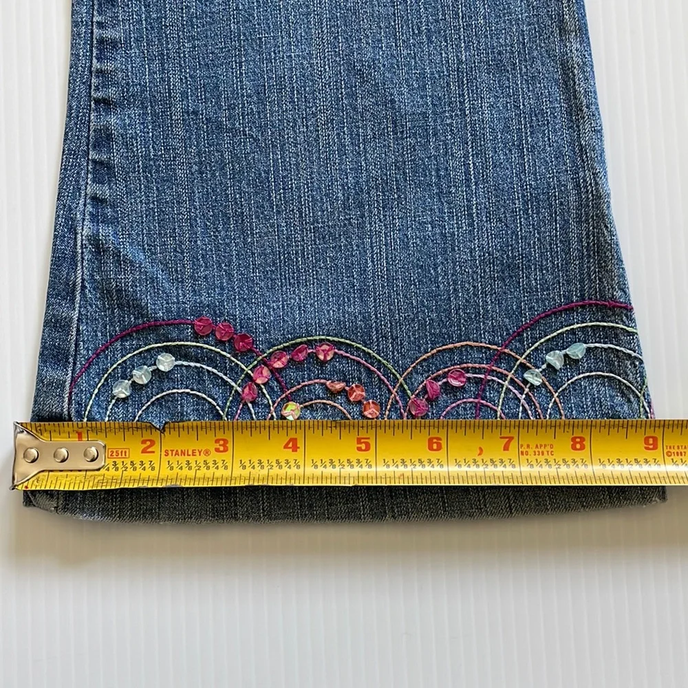 Flared Gymboree jeans with rainbow stitching & beading.  Girls size 9